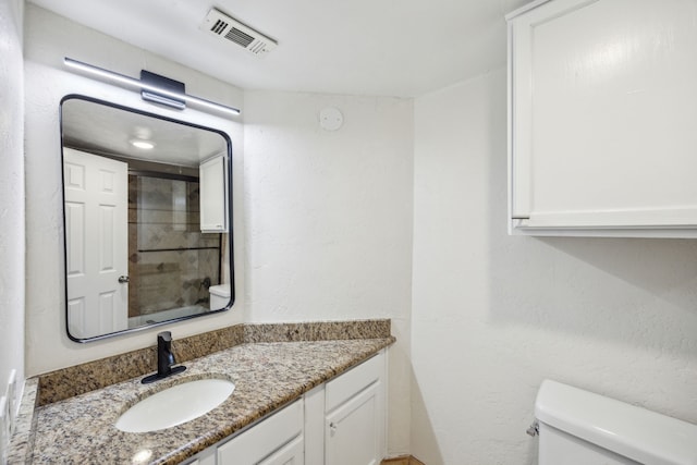 6108 Abrams Rd Unit 601, Dallas, TX 75231 - full bathroom with toilet, vanity, and a shower