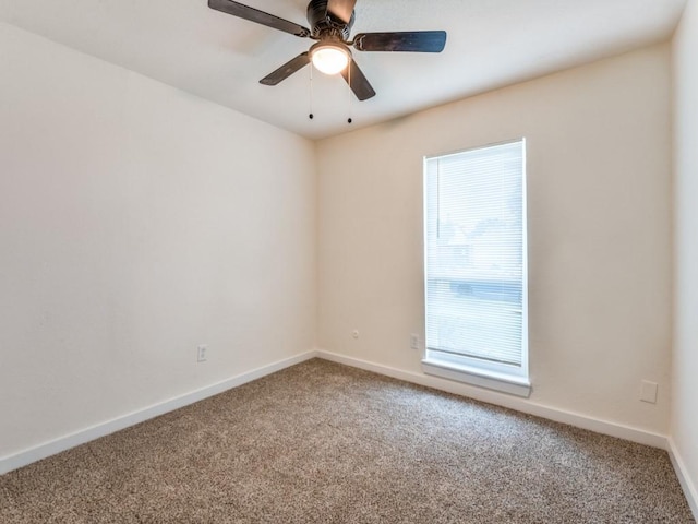5201 Keller Cir, The Colony, TX 75056 - spare room with carpet floors, baseboards, and ceiling fan
