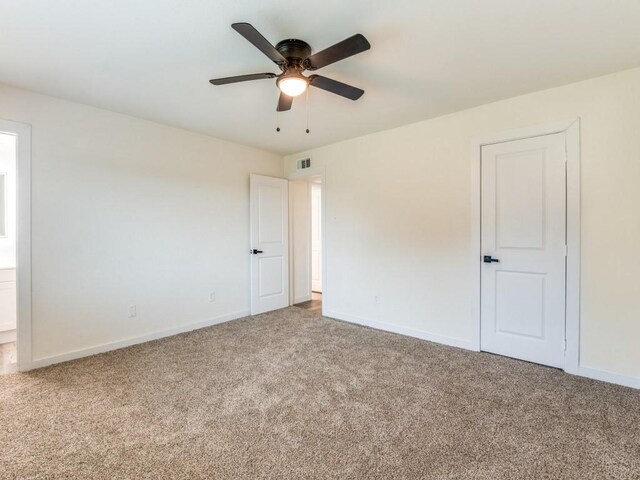 5201 Keller Cir, The Colony, TX 75056 - carpeted spare room featuring baseboards and a ceiling fan