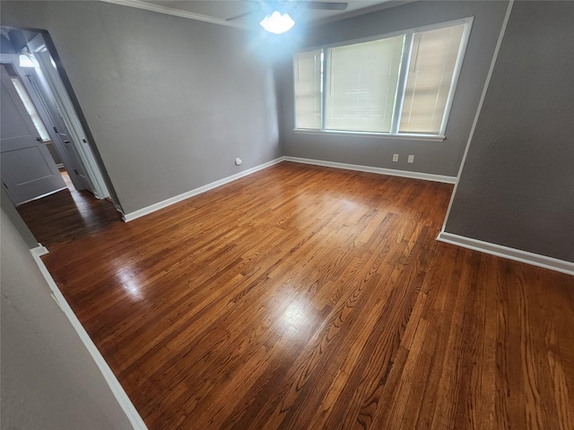 1510 Leslie St, Bossier City, LA 71111 - spare room with wood finished floors, baseboards, a ceiling fan, and ornamental molding
