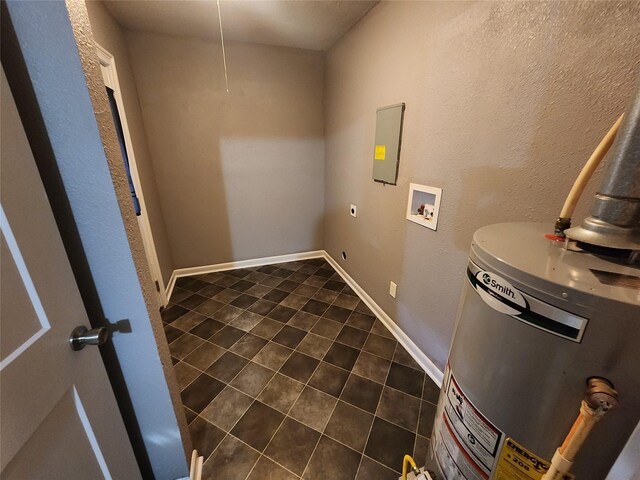 1510 Leslie St, Bossier City, LA 71111 - laundry room featuring gas water heater, dark tile patterned floors, electric dryer hookup, hookup for a washing machine, and attic access