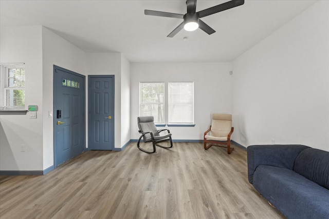 4706 Spring Ave, Dallas, TX 75210 - sitting room with plenty of natural light, light wood finished floors, and a ceiling fan