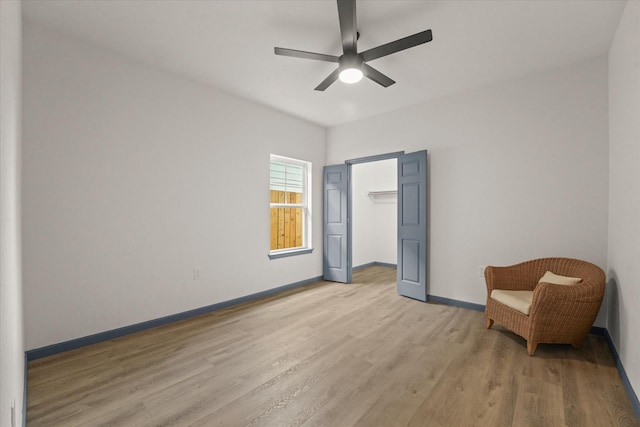 4706 Spring Ave, Dallas, TX 75210 - living area featuring light wood-style floors and a ceiling fan