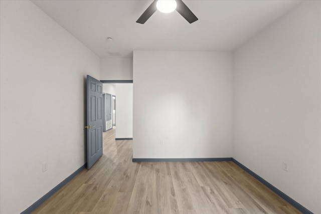 4706 Spring Ave, Dallas, TX 75210 - spare room featuring baseboards, light wood-type flooring, and ceiling fan