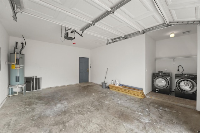 4706 Spring Ave, Dallas, TX 75210 - garage with washer and clothes dryer, electric water heater, and a garage door opener