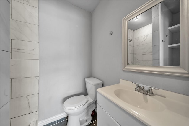 6423 Fisher Rd, Dallas, TX 75214 - bathroom with vanity, toilet, and baseboards