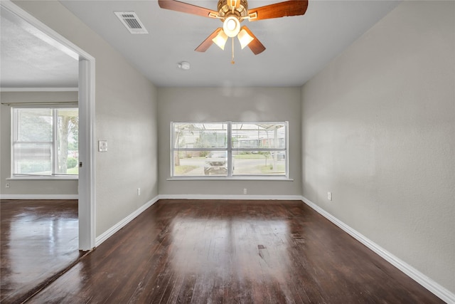 6423 Fisher Rd, Dallas, TX 75214 - unfurnished room with wood finished floors, baseboards, and ceiling fan