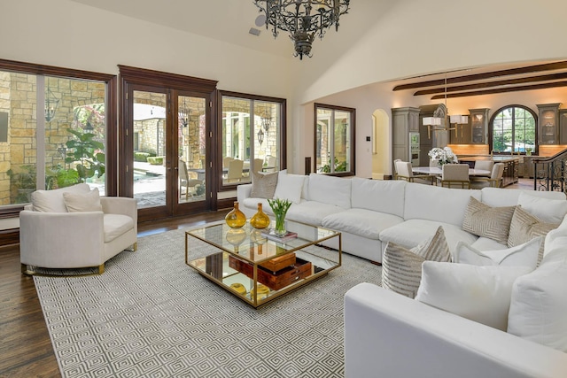 9996 Hollow Way Rd, Dallas, TX 75220 - living room with wood finished floors, a chandelier, arched walkways, and french doors