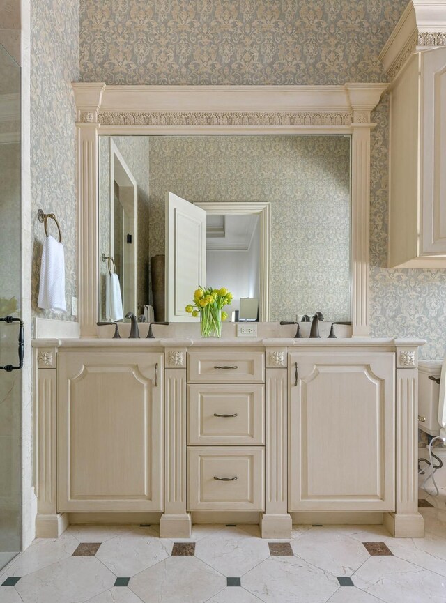 9996 Hollow Way Rd, Dallas, TX 75220 - bathroom featuring wallpapered walls, double vanity, a stall shower, and ornamental molding