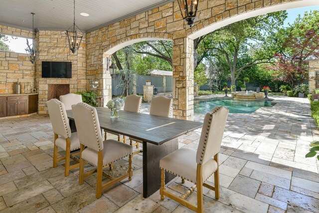 9996 Hollow Way Rd, Dallas, TX 75220 - view of patio featuring exterior kitchen, outdoor dining space, a ceiling fan, and a pool with connected hot tub