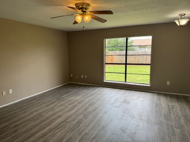 511 Hanover Dr, Allen, TX 75002 - empty room with ceiling fan, dark wood finished floors, and baseboards