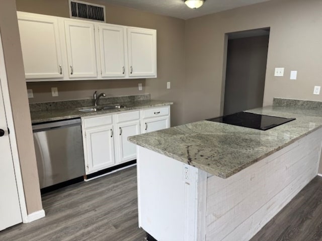 511 Hanover Dr, Allen, TX 75002 - kitchen featuring stainless steel dishwasher, black electric stovetop, a peninsula, dark wood finished floors, and white cabinetry