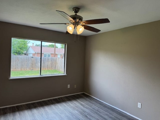 511 Hanover Dr, Allen, TX 75002 - unfurnished room featuring wood finished floors, baseboards, and ceiling fan