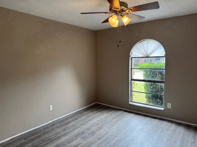 511 Hanover Dr, Allen, TX 75002 - empty room featuring wood finished floors, a ceiling fan, and baseboards