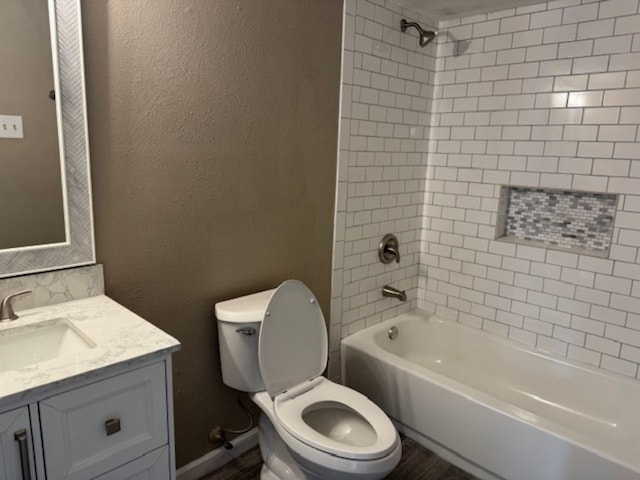511 Hanover Dr, Allen, TX 75002 - full bath with toilet, vanity, tub / shower combination, wood finished floors, and a textured wall
