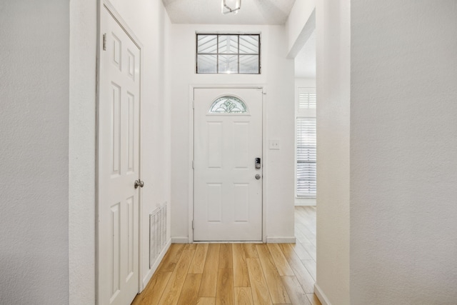 226 E Ridgegate Dr, Garland, TX 75040 - foyer featuring light wood-style flooring and baseboards