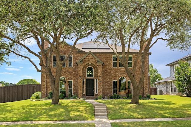 6821 Rochelle Dr, Plano, TX 75023 - traditional home featuring roof mounted solar panels and brick siding