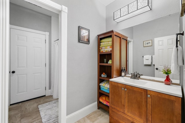 6821 Rochelle Dr, Plano, TX 75023 - full bathroom featuring vanity and baseboards