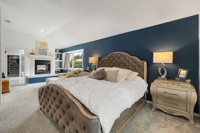 6821 Rochelle Dr, Plano, TX 75023 - carpeted bedroom with lofted ceiling, a glass covered fireplace, and baseboards