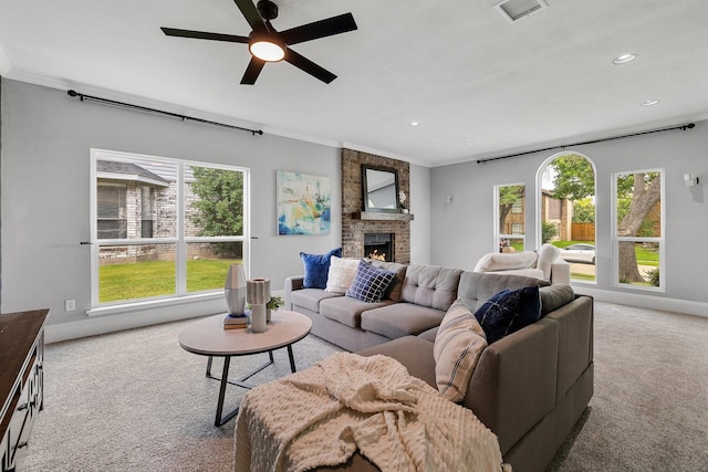 6821 Rochelle Dr, Plano, TX 75023 - living area featuring carpet, ornamental molding, healthy amount of natural light, a brick fireplace, and baseboards