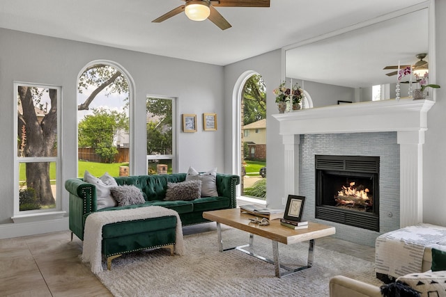 6821 Rochelle Dr, Plano, TX 75023 - living area featuring ceiling fan, healthy amount of natural light, and a tiled fireplace