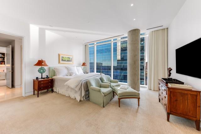 1747 Leonard St Unit 903, Dallas, TX 75201 - bedroom featuring floor to ceiling windows, light carpet, and access to outside