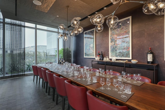 1747 Leonard St Unit 903, Dallas, TX 75201 - dining space featuring a chandelier and expansive windows