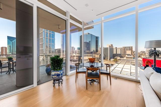 1747 Leonard St Unit 903, Dallas, TX 75201 - sunroom featuring a view of skyline