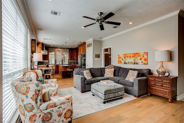 6712 E Park Dr, Fort Worth, TX 76132 - living area featuring light wood-style floors, ceiling fan, crown molding, and recessed lighting