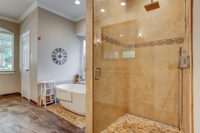 6712 E Park Dr, Fort Worth, TX 76132 - bathroom with a shower stall, ornamental molding, a freestanding tub, and baseboards
