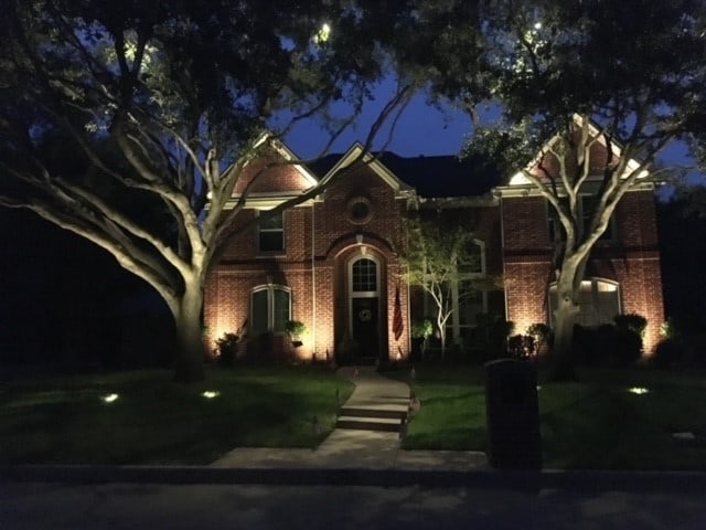 6712 E Park Dr, Fort Worth, TX 76132 - view of front facade featuring brick siding and a yard