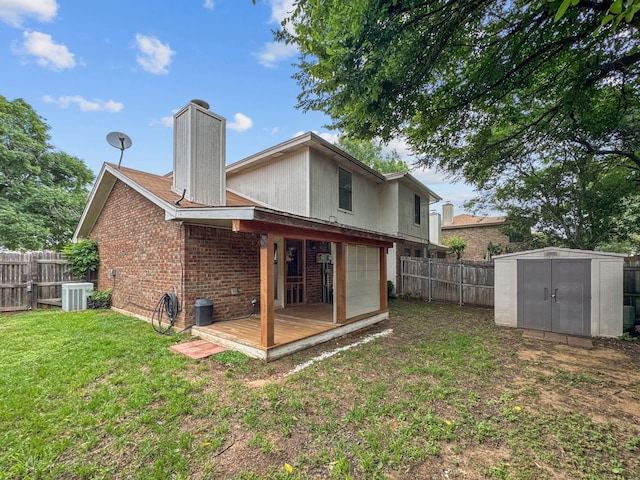 539 Mel Ct, Euless, TX 76039 - back of property featuring central air condition unit, brick siding, a garage, a chimney, and a deck