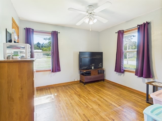 104 Sunny Ln, Athens, TX 75751 - living area with plenty of natural light, light wood-type flooring, ceiling fan, and baseboards