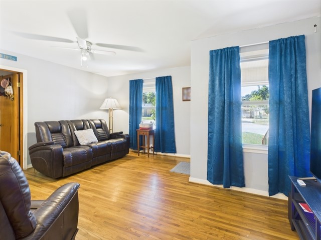 104 Sunny Ln, Athens, TX 75751 - living area with wood finished floors, ceiling fan, and baseboards