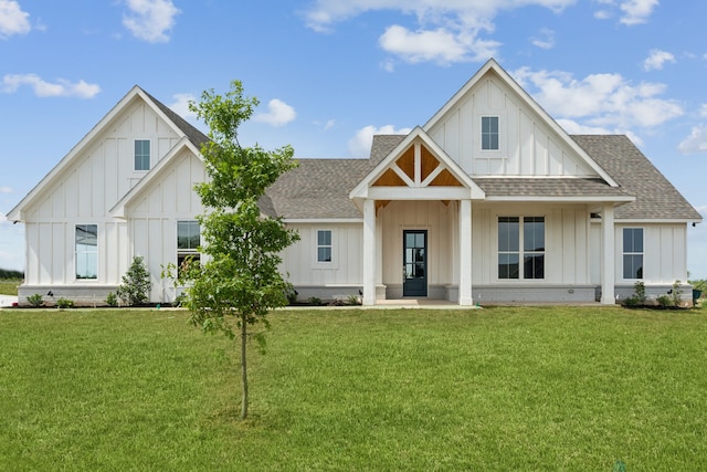 106 Maverick Way, Boyd, TX 76023 - modern inspired farmhouse featuring board and batten siding, roof with shingles, and a front lawn