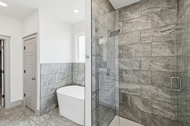 106 Maverick Way, Boyd, TX 76023 - bathroom with a shower stall, a soaking tub, recessed lighting, and marble finish flooring