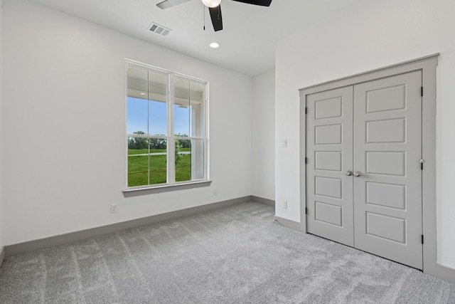 106 Maverick Way, Boyd, TX 76023 - unfurnished bedroom featuring carpet flooring, baseboards, a closet, and a ceiling fan
