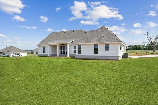 106 Maverick Way, Boyd, TX 76023 - rear view of property with a lawn, roof with shingles, and cooling unit