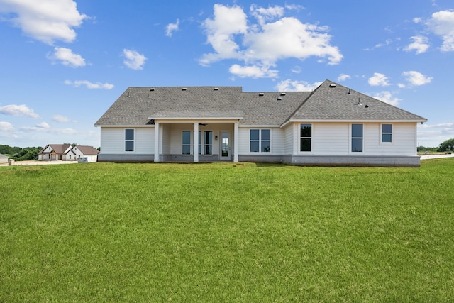 106 Maverick Way, Boyd, TX 76023 - back of property featuring a shingled roof and a yard