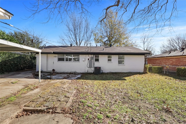 2713 Wembley Dr, Garland, TX 75041 - back of property with central AC and a carport