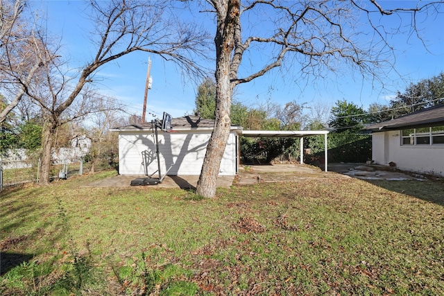 2713 Wembley Dr, Garland, TX 75041 - view of grassy yard with a carport and an outdoor structure