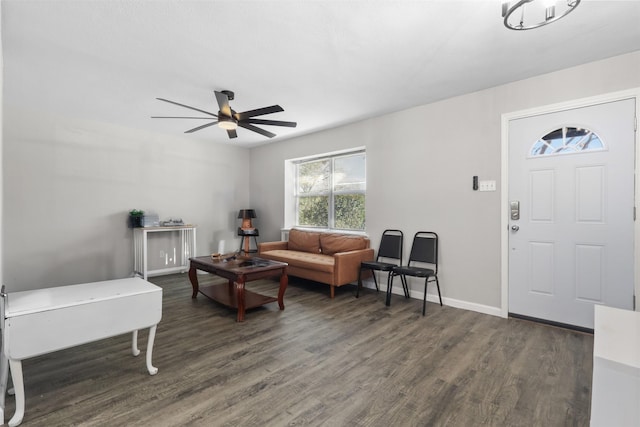 2713 Wembley Dr, Garland, TX 75041 - living area with dark wood finished floors, ceiling fan, and baseboards