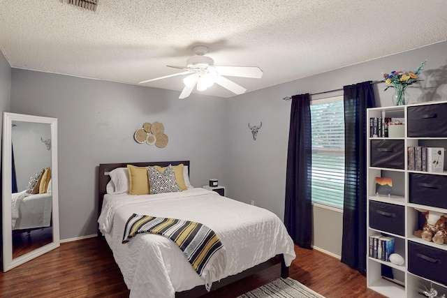 1211 Leeward Ln, Wylie, TX 75098 - bedroom featuring wood finished floors, a textured ceiling, a ceiling fan, and baseboards