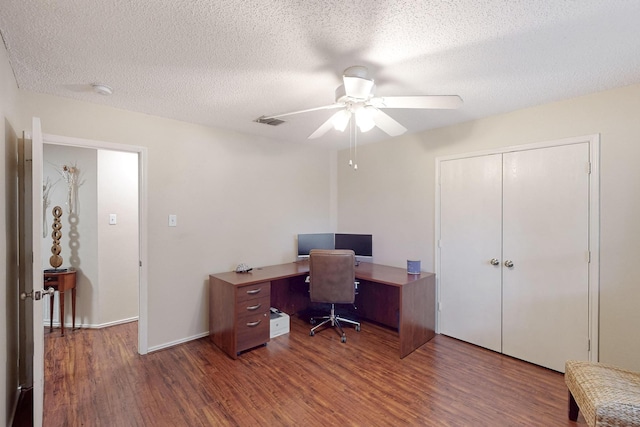 1211 Leeward Ln, Wylie, TX 75098 - office space with wood finished floors, a ceiling fan, and a textured ceiling