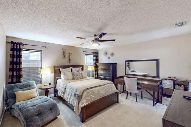 1211 Leeward Ln, Wylie, TX 75098 - bedroom with light colored carpet, a ceiling fan, and a textured ceiling