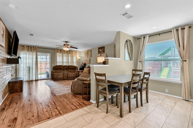 4318 Quail Run Rd, Sherman, TX 75092 - dining area with plenty of natural light, baseboards, a ceiling fan, and a stone fireplace