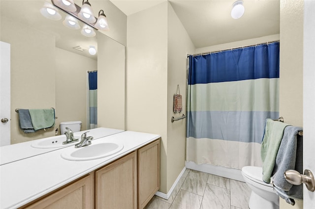 4318 Quail Run Rd, Sherman, TX 75092 - bathroom featuring toilet, vanity, marble look tile flooring, and curtained shower
