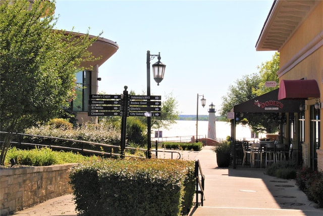730 Hidden Feather, Lavon, TX 75166 - view of community with a water view and outdoor dining area