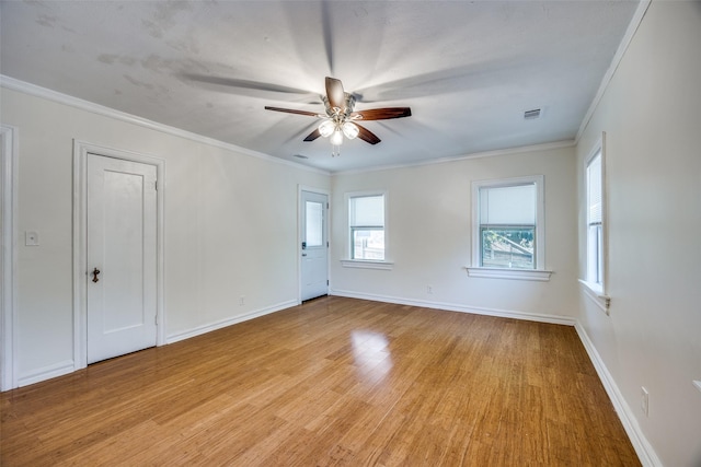 6819 Santa Fe Ave, Dallas, TX 75223 - empty room featuring ceiling fan, light wood-style flooring, crown molding, and baseboards
