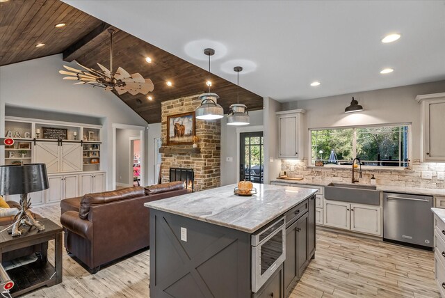 426 Vz County Road 2808, Mabank, TX 75147 - kitchen featuring stainless steel appliances, a sink, light wood-type flooring, a fireplace, and recessed lighting